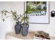 Stylishly decorated shelf with vases, books, and a decorative tray enhancing the room's ambiance at 8111 Lianna Dr, Orlando, FL 32822
