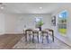 Bright dining room features modern decor, a neutral color palette, and lots of natural light at 8111 Lianna Dr, Orlando, FL 32822