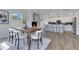 Open floor plan showing the dining area with fireplace and modern kitchen with island at 8111 Lianna Dr, Orlando, FL 32822