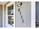 Close up of the front door numbers, 8111, and doorbell at 8111 Lianna Dr, Orlando, FL 32822