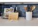 Close-up of kitchen countertop decor featuring cookbooks and wooden cooking utensils at 8111 Lianna Dr, Orlando, FL 32822