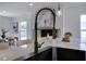 Close-up of kitchen island sink and countertop with dining area and fireplace backdrop at 8111 Lianna Dr, Orlando, FL 32822
