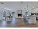 Spacious kitchen and dining area features a fireplace and a breakfast bar with seating at 8111 Lianna Dr, Orlando, FL 32822