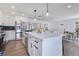 Spacious kitchen featuring an island, stainless steel appliances, and open concept design at 8111 Lianna Dr, Orlando, FL 32822