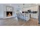 Modern kitchen features stainless steel appliances, a fireplace, and a breakfast bar at 8111 Lianna Dr, Orlando, FL 32822