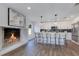 Stylish kitchen includes stainless steel appliances, a fireplace, and modern barstool seating at 8111 Lianna Dr, Orlando, FL 32822