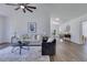 Spacious living room with vaulted ceilings, modern furniture and wood-look floors at 8111 Lianna Dr, Orlando, FL 32822
