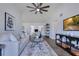 Bright living room with vaulted ceilings, ceiling fan and wood-look flooring at 8111 Lianna Dr, Orlando, FL 32822