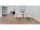 Bright living room featuring wood floors and modern decor with two stylish chairs at 8111 Lianna Dr, Orlando, FL 32822
