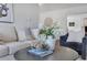 Inviting living room featuring a comfortable couch, decorative pillows, and stylish decor at 8111 Lianna Dr, Orlando, FL 32822