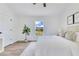 Bright main bedroom with a comfortable bed, neutral decor, and ample natural light from the window at 8111 Lianna Dr, Orlando, FL 32822