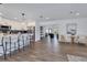 Open concept living space features kitchen, dining area and living room with wood floors at 8111 Lianna Dr, Orlando, FL 32822