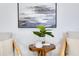 Cozy sitting area with comfortable seating, a unique side table, and stylish wall art at 8111 Lianna Dr, Orlando, FL 32822