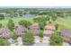 Aerial view of the homes, lake and golf course in the community at 8162 Prestbury Dr, Orlando, FL 32832