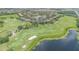 Community aerial view with golf course and lake at 8162 Prestbury Dr, Orlando, FL 32832