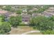 Aerial view of house with backyard, patio, and trees near a golf course at 8162 Prestbury Dr, Orlando, FL 32832