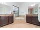 Spacious bathroom with a soaking tub nestled between dual vanities, creating a spa-like retreat at 8162 Prestbury Dr, Orlando, FL 32832