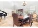 Dining room featuring a large wood table and access to the foyer at 8162 Prestbury Dr, Orlando, FL 32832