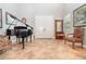 Spacious tiled foyer with a grand piano and classic furnishings at 8162 Prestbury Dr, Orlando, FL 32832