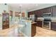 Charming kitchen with dark wood cabinets and a breakfast bar at 8162 Prestbury Dr, Orlando, FL 32832