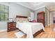 Serene main bedroom with tray ceilings, neutral tones, and an en-suite bathroom creating a private oasis at 8162 Prestbury Dr, Orlando, FL 32832