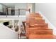 Elegant staircase with hardwood steps and decorative railings at 8162 Prestbury Dr, Orlando, FL 32832