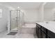 Bathroom with a combined bathtub and shower, and a double vanity at 8955 Fluffy Lie Ct, Davenport, FL 33896
