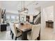Open-concept dining area with stylish lighting, seamlessly connected to the kitchen and living spaces at 8955 Fluffy Lie Ct, Davenport, FL 33896