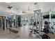 A well-equipped gym with modern fitness equipment and ample space for a comprehensive workout at 8955 Fluffy Lie Ct, Davenport, FL 33896