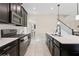 Well-equipped kitchen with stainless steel appliances, a white countertop island, and ample cabinet space at 8955 Fluffy Lie Ct, Davenport, FL 33896