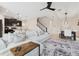Open-concept living space with a comfortable sofa, dining area, and modern kitchen in view at 8955 Fluffy Lie Ct, Davenport, FL 33896