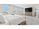 Spacious main bedroom features three windows, a TV, and a large dresser at 8955 Fluffy Lie Ct, Davenport, FL 33896
