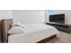 Comfortable main bedroom with queen bed and large television at 8955 Fluffy Lie Ct, Davenport, FL 33896