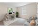 Well-lit home office with modern desk, chairs, and natural light at 8955 Fluffy Lie Ct, Davenport, FL 33896
