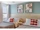 Charming bedroom with two twin beds, playful artwork, and a bright, airy feel at 9023 Shadow Mountain St, Davenport, FL 33896