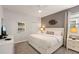Relaxing bedroom with a queen bed, stylish wall decor, and a neutral color palette at 9023 Shadow Mountain St, Davenport, FL 33896