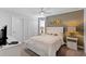 Cozy bedroom with a queen bed, stylish wall art, and a ceiling fan for added comfort at 9023 Shadow Mountain St, Davenport, FL 33896