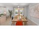 Bright dining room area with views of the outside pool through large sliding glass doors, and an open-concept flow at 9023 Shadow Mountain St, Davenport, FL 33896