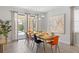 Bright dining room area with views of the outside pool through large sliding glass doors, and an open-concept flow at 9023 Shadow Mountain St, Davenport, FL 33896