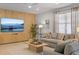 Inviting living room featuring modern decor, a large television, and comfortable seating at 9023 Shadow Mountain St, Davenport, FL 33896
