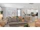 Open-concept living room, seamlessly connecting kitchen and dining areas, perfect for hosting gatherings at 9023 Shadow Mountain St, Davenport, FL 33896