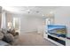 Open-concept living room offering comfortable seating and a modern media center at 9023 Shadow Mountain St, Davenport, FL 33896