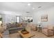 Open-concept living room connects to kitchen and dining area, providing a spacious entertaining area at 9023 Shadow Mountain St, Davenport, FL 33896