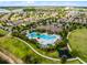 Enjoy this community's luxurious swimming pool, lounge seating, and tropical landscaping at 9128 Sonoma Coast Dr, Winter Garden, FL 34787