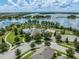 Beautiful aerial view of community pool, lake, park, and surrounding landscape at 9128 Sonoma Coast Dr, Winter Garden, FL 34787