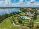 Stunning aerial view of the community pool, mini golf, clubhouse and lake at 9128 Sonoma Coast Dr, Winter Garden, FL 34787