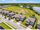 Two-story home with manicured lawn, screened in patio, close to community amenities and lush surroundings at 9128 Sonoma Coast Dr, Winter Garden, FL 34787