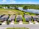 Desirable two-story home with beautiful pond views, manicured landscaping, and a paved driveway at 9128 Sonoma Coast Dr, Winter Garden, FL 34787