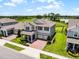 Aerial view of the two-story home, manicured lawn, and landscaping at 9128 Sonoma Coast Dr, Winter Garden, FL 34787