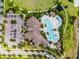 Overhead view showcases community pool, parking, landscaping, and clubhouse at 9128 Sonoma Coast Dr, Winter Garden, FL 34787